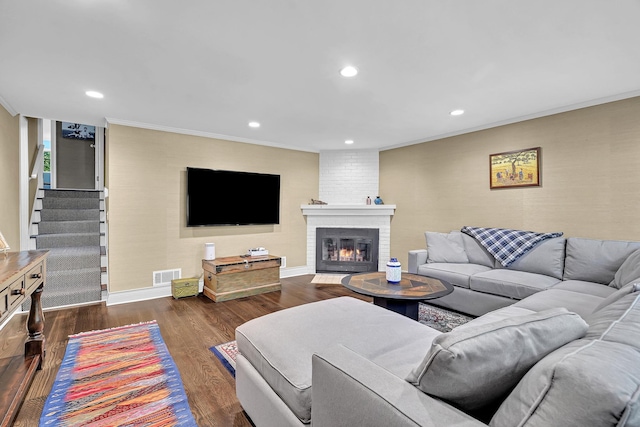 9 Springdale Rd, Scarsdale, NY 10583 - living area featuring ornamental molding, recessed lighting, a brick fireplace, baseboards, and dark wood-style floors