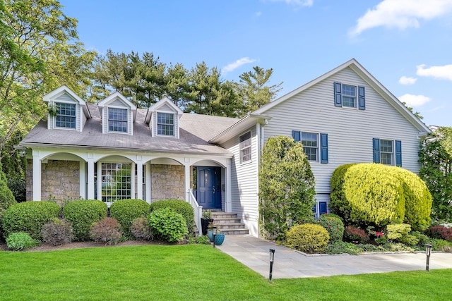 9 Springdale Rd, Scarsdale, NY 10583 - view of front of house with a front lawn, stone siding, and a porch