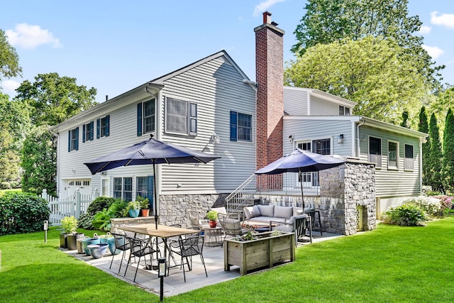 9 Springdale Rd, Scarsdale, NY 10583 - back of property with outdoor lounge area, a patio, a chimney, stone siding, and stairs