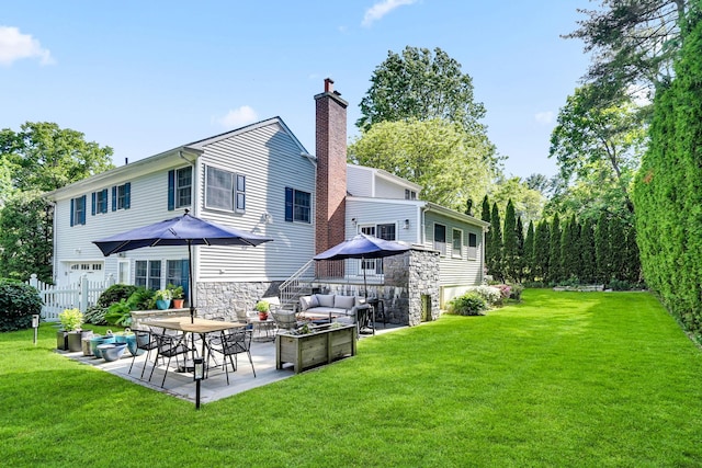 9 Springdale Rd, Scarsdale, NY 10583 - back of house featuring an outdoor living space, a patio, a chimney, and stone siding