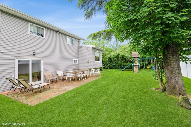 756 Dumont Pl, North Woodmere, NY 11581 - view of grassy yard with a patio area and a playground