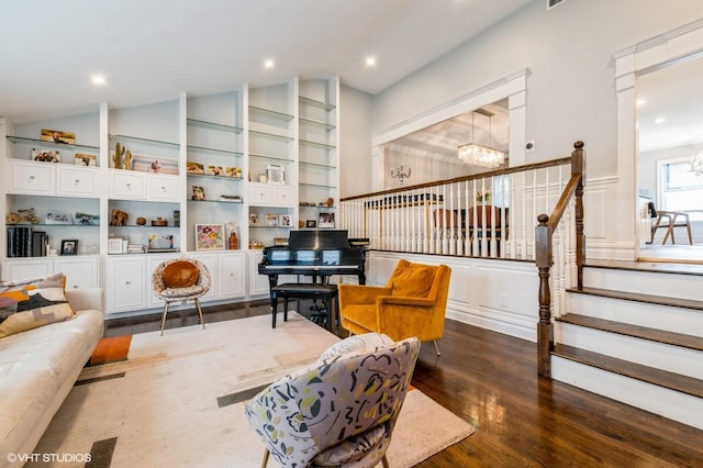 756 Dumont Pl, North Woodmere, NY 11581 - sitting room with a chandelier, vaulted ceiling, wood finished floors, stairway, and recessed lighting