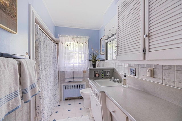 891 Pondview Rd, Riverhead, NY 11901 - full bath with radiator, toilet, vanity, and crown molding