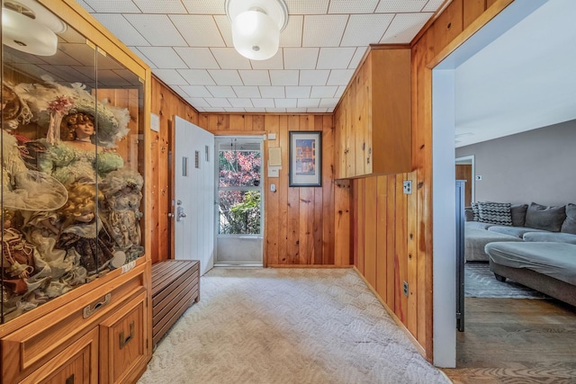 891 Pondview Rd, Riverhead, NY 11901 - hall featuring wooden walls and light colored carpet