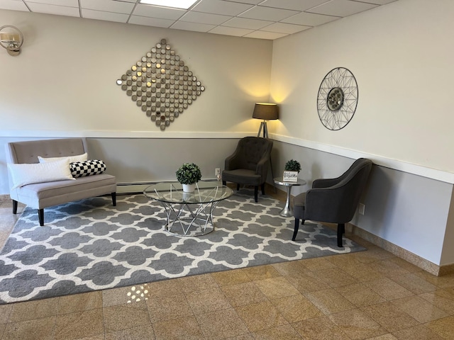 101 Jackson Ave Unit 4A, Mineola, NY 11501 - sitting room with a paneled ceiling, baseboards, and baseboard heating