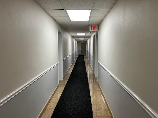 101 Jackson Ave Unit 4A, Mineola, NY 11501 - hall featuring a drop ceiling and baseboards