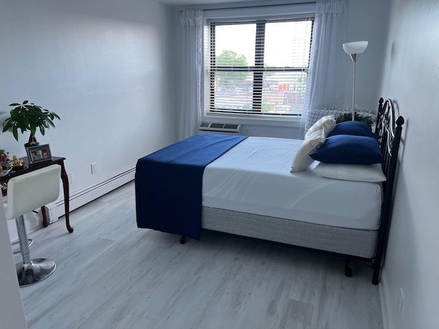 101 Jackson Ave Unit 4A, Mineola, NY 11501 - bedroom featuring wood finished floors and baseboard heating