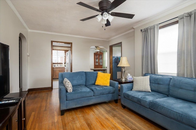 139 Euston Rd S, West Hempstead, NY 11552 - living room featuring ceiling fan, hardwood / wood-style floors, arched walkways, crown molding, and baseboards