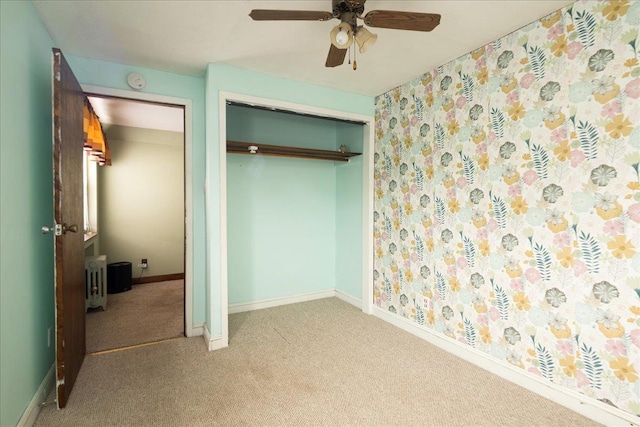 139 Euston Rd S, West Hempstead, NY 11552 - unfurnished bedroom featuring carpet, a closet, baseboards, and a ceiling fan