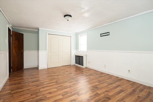 139 Euston Rd S, West Hempstead, NY 11552 - unfurnished bedroom featuring wood finished floors, a closet, crown molding, and baseboards