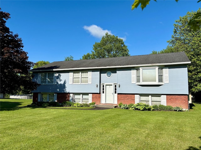 25 White Farm Rd, Wingdale, NY 12594 - bi-level home with a front yard and brick siding