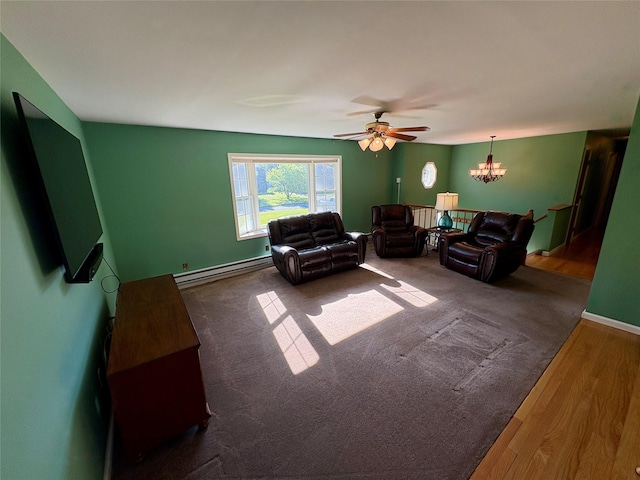 25 White Farm Rd, Wingdale, NY 12594 - living area with a baseboard heating unit, a ceiling fan, wood finished floors, a chandelier, and baseboards