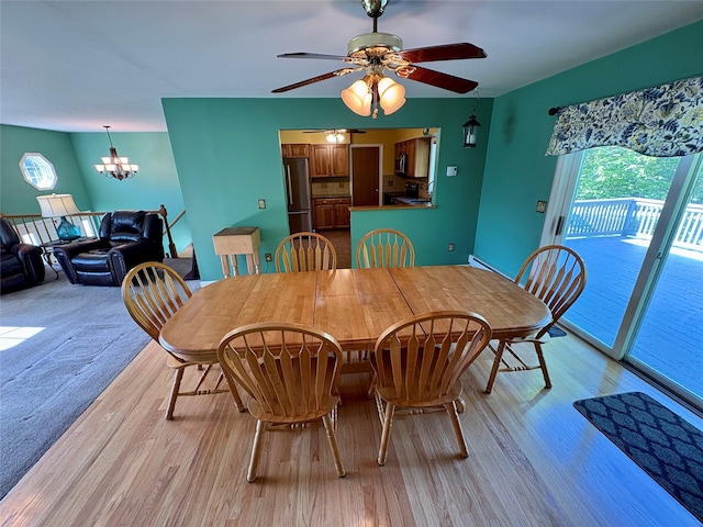 25 White Farm Rd, Wingdale, NY 12594 - dining area with light wood-style floors, a chandelier, and ceiling fan