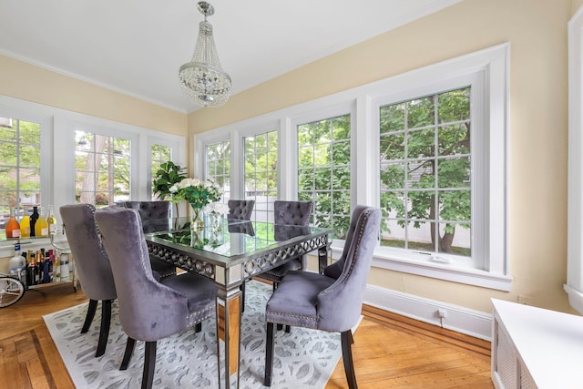 177 N Long Beach Ave, Freeport, NY 11520 - dining room with a chandelier, crown molding, plenty of natural light, and baseboards