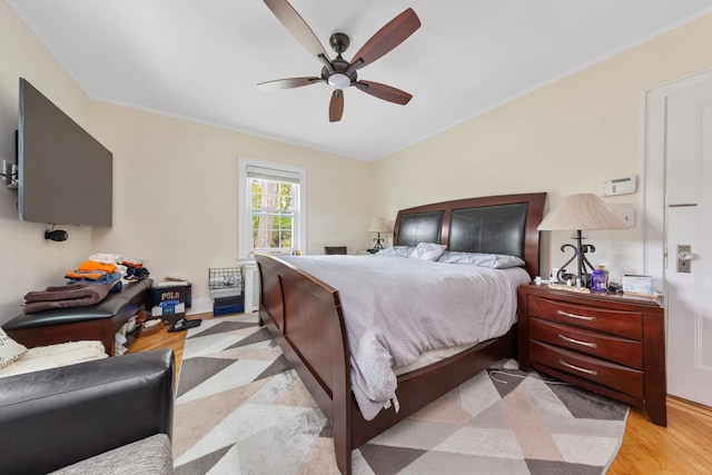 177 N Long Beach Ave, Freeport, NY 11520 - bedroom featuring light wood-style flooring, crown molding, and a ceiling fan