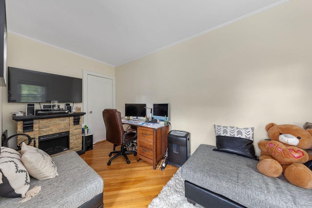 177 N Long Beach Ave, Freeport, NY 11520 - bedroom with light wood-style flooring, a fireplace, and crown molding