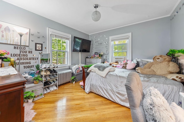 177 N Long Beach Ave, Freeport, NY 11520 - bedroom with radiator heating unit, ornamental molding, and light wood finished floors
