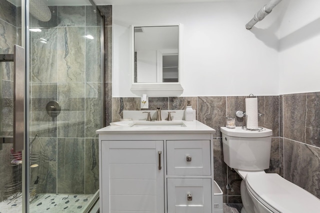 177 N Long Beach Ave, Freeport, NY 11520 - full bath featuring toilet, a shower stall, vanity, tile walls, and a wainscoted wall