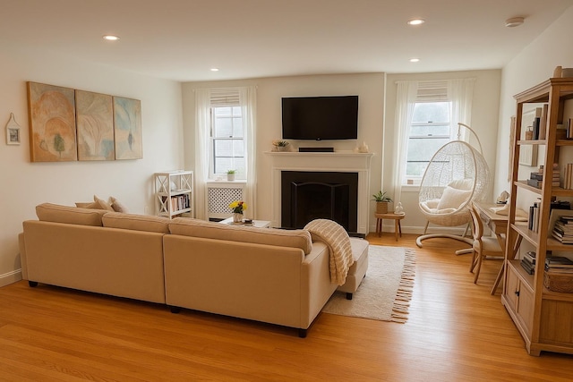 68 E Hartsdale Ave Unit 5E, Hartsdale, NY 10530 - living area with light wood finished floors, plenty of natural light, recessed lighting, a fireplace, and baseboards
