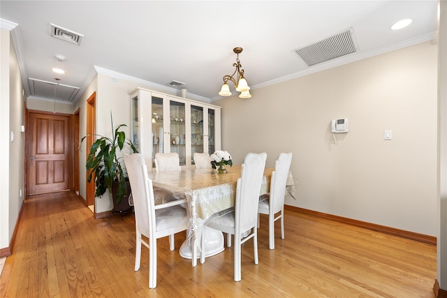 154-16 13th Ave, Whitestone, NY 11357 - dining space featuring attic access, crown molding, baseboards, light wood-style flooring, and a chandelier