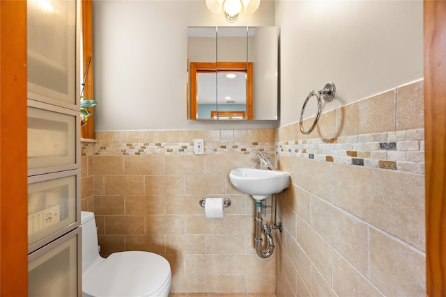 154-16 13th Ave, Whitestone, NY 11357 - half bathroom featuring tile walls, toilet, and wainscoting