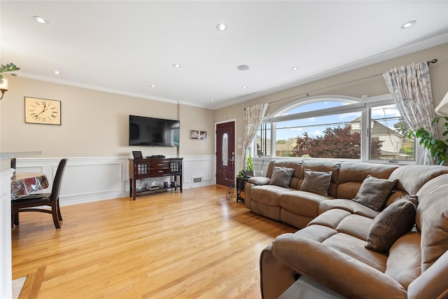 154-16 13th Ave, Whitestone, NY 11357 - living area featuring light wood finished floors, crown molding, wainscoting, and recessed lighting