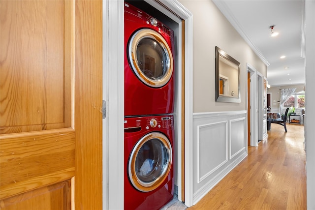 154-16 13th Ave, Whitestone, NY 11357 - laundry room featuring stacked washing machine and dryer, ornamental molding, light wood finished floors, wainscoting, and recessed lighting