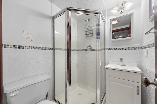 154-16 13th Ave, Whitestone, NY 11357 - bathroom with tile walls, vanity, toilet, and a stall shower
