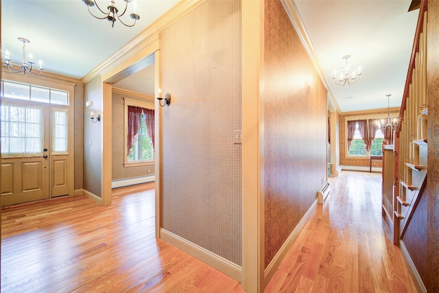 231 Turtle Bay Rd, New Hampton, NY 10958 - corridor featuring a chandelier, a baseboard heating unit, crown molding, and light wood-style flooring