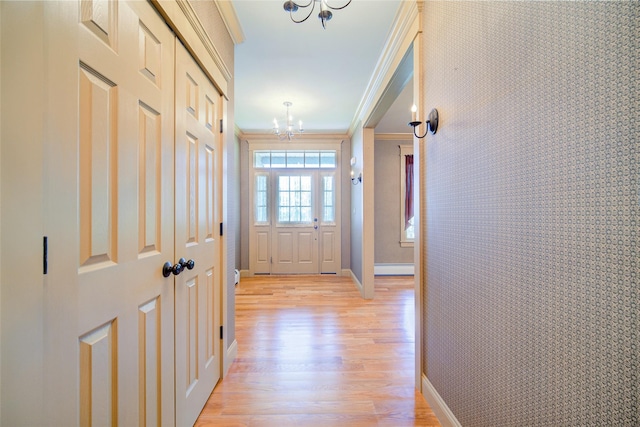231 Turtle Bay Rd, New Hampton, NY 10958 - corridor featuring a chandelier, light wood-style floors, ornamental molding, a baseboard radiator, and baseboards