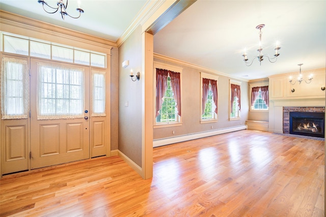 231 Turtle Bay Rd, New Hampton, NY 10958 - entrance foyer with a chandelier, baseboard heating, ornamental molding, light wood finished floors, and baseboards