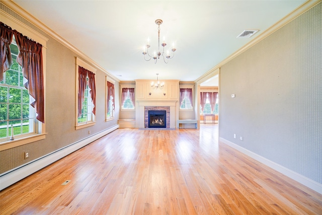 231 Turtle Bay Rd, New Hampton, NY 10958 - unfurnished living room featuring ornamental molding, a chandelier, baseboard heating, light wood-style floors, and baseboards