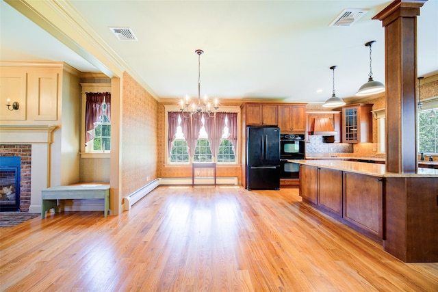 231 Turtle Bay Rd, New Hampton, NY 10958 - kitchen with black appliances, ornamental molding, plenty of natural light, brown cabinets, and glass insert cabinets