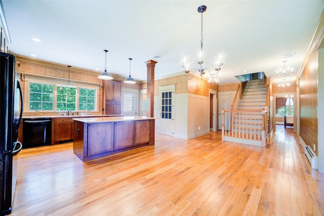 231 Turtle Bay Rd, New Hampton, NY 10958 - kitchen featuring a chandelier, black appliances, light countertops, a center island, and light wood-type flooring