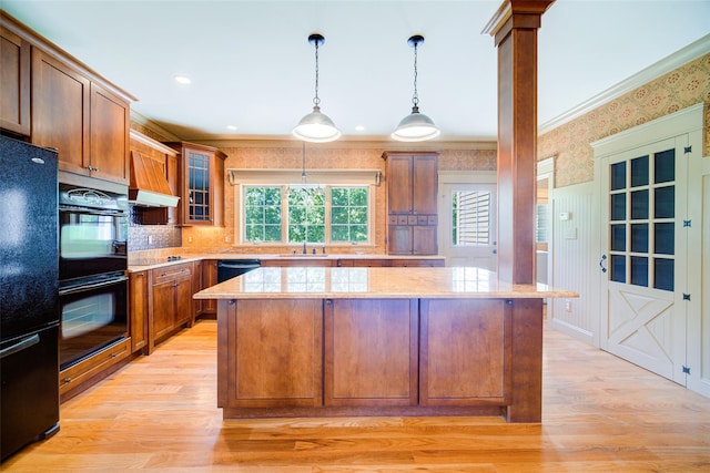 231 Turtle Bay Rd, New Hampton, NY 10958 - kitchen featuring black appliances, light wood-type flooring, a sink, a center island, and crown molding