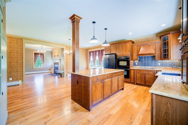 231 Turtle Bay Rd, New Hampton, NY 10958 - kitchen featuring black appliances, a baseboard heating unit, custom range hood, a sink, and light wood finished floors