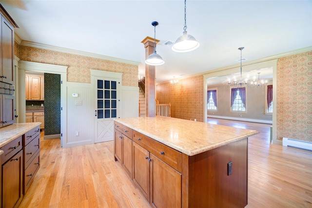 231 Turtle Bay Rd, New Hampton, NY 10958 - kitchen featuring wallpapered walls, light wood finished floors, crown molding, pendant lighting, and a kitchen island