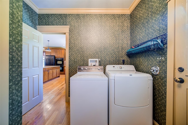 231 Turtle Bay Rd, New Hampton, NY 10958 - laundry room with wallpapered walls, light wood finished floors, washing machine and clothes dryer, and ornamental molding