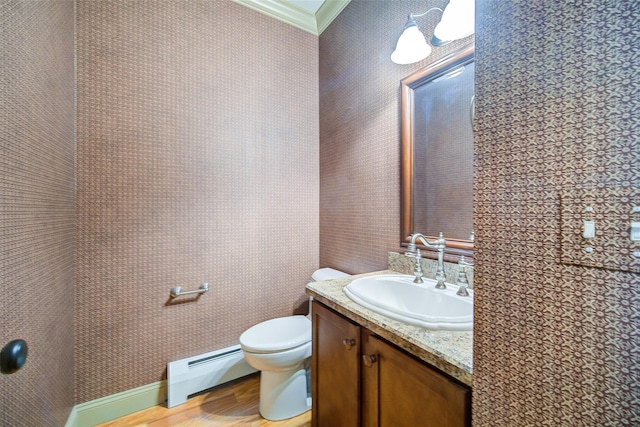 231 Turtle Bay Rd, New Hampton, NY 10958 - half bathroom with a baseboard heating unit, vanity, ornamental molding, toilet, and wood finished floors