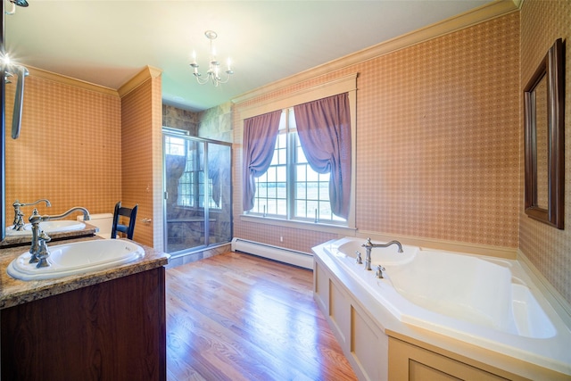231 Turtle Bay Rd, New Hampton, NY 10958 - bathroom featuring wallpapered walls, a baseboard heating unit, a garden tub, ornamental molding, and a chandelier