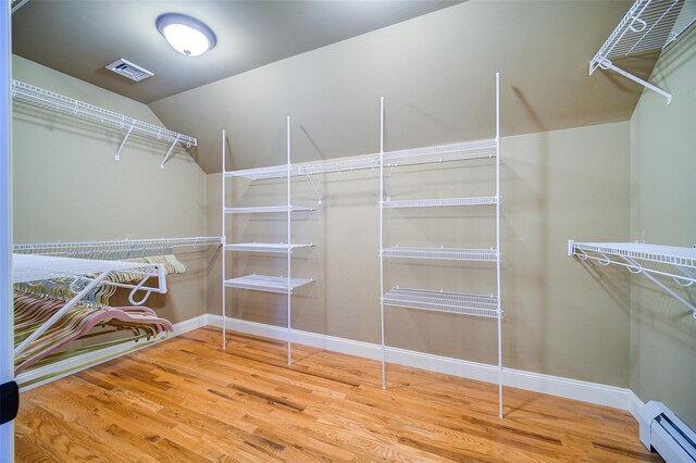 231 Turtle Bay Rd, New Hampton, NY 10958 - walk in closet with a baseboard radiator and wood finished floors