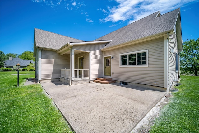 231 Turtle Bay Rd, New Hampton, NY 10958 - rear view of property with roof with shingles, a yard, and a patio