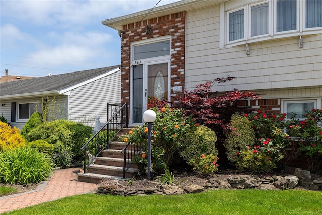 563 Long Beach Rd, Island Park, NY 11558 - property entrance with brick siding