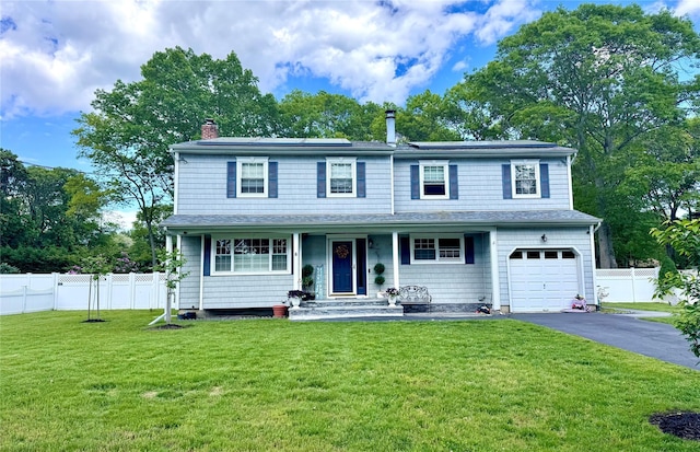 2337 Sycamore Ave, Ronkonkoma, NY 11779 - view of front of home with asphalt driveway, a chimney, roof mounted solar panels, a garage, and a porch
