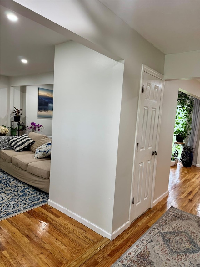 2337 Sycamore Ave, Ronkonkoma, NY 11779 - corridor with wood finished floors, baseboards, and recessed lighting
