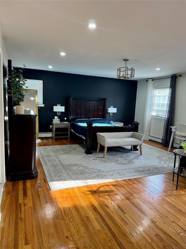 2337 Sycamore Ave, Ronkonkoma, NY 11779 - bedroom featuring a baseboard radiator, wood finished floors, recessed lighting, baseboards, and billiards