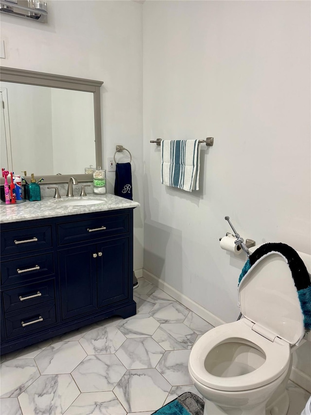 2337 Sycamore Ave, Ronkonkoma, NY 11779 - half bath featuring vanity, marble finish flooring, toilet, and baseboards