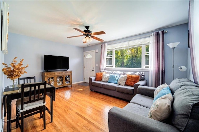 26 Booth Blvd, Wappingers Falls, NY 12590 - living area featuring light wood-style floors, a ceiling fan, and baseboards