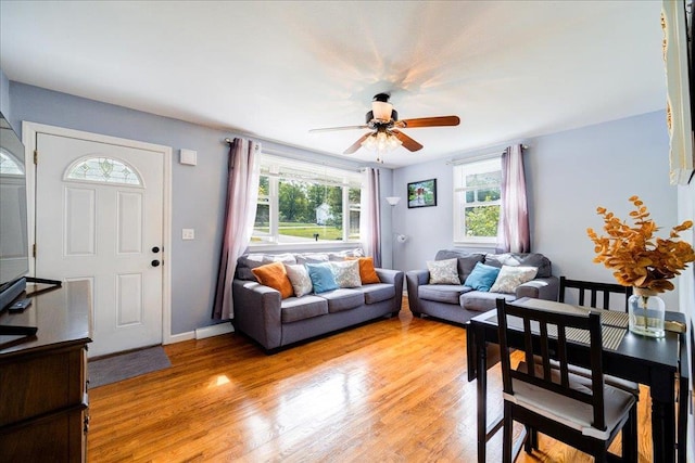 26 Booth Blvd, Wappingers Falls, NY 12590 - living area featuring plenty of natural light, a ceiling fan, light wood-style flooring, and baseboards