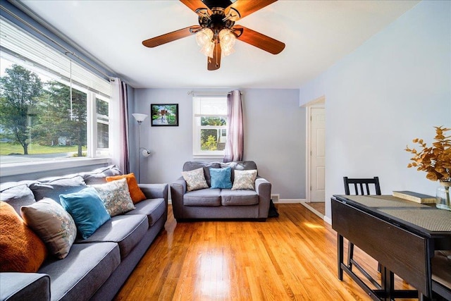 26 Booth Blvd, Wappingers Falls, NY 12590 - living room with light wood-type flooring, a ceiling fan, and baseboards